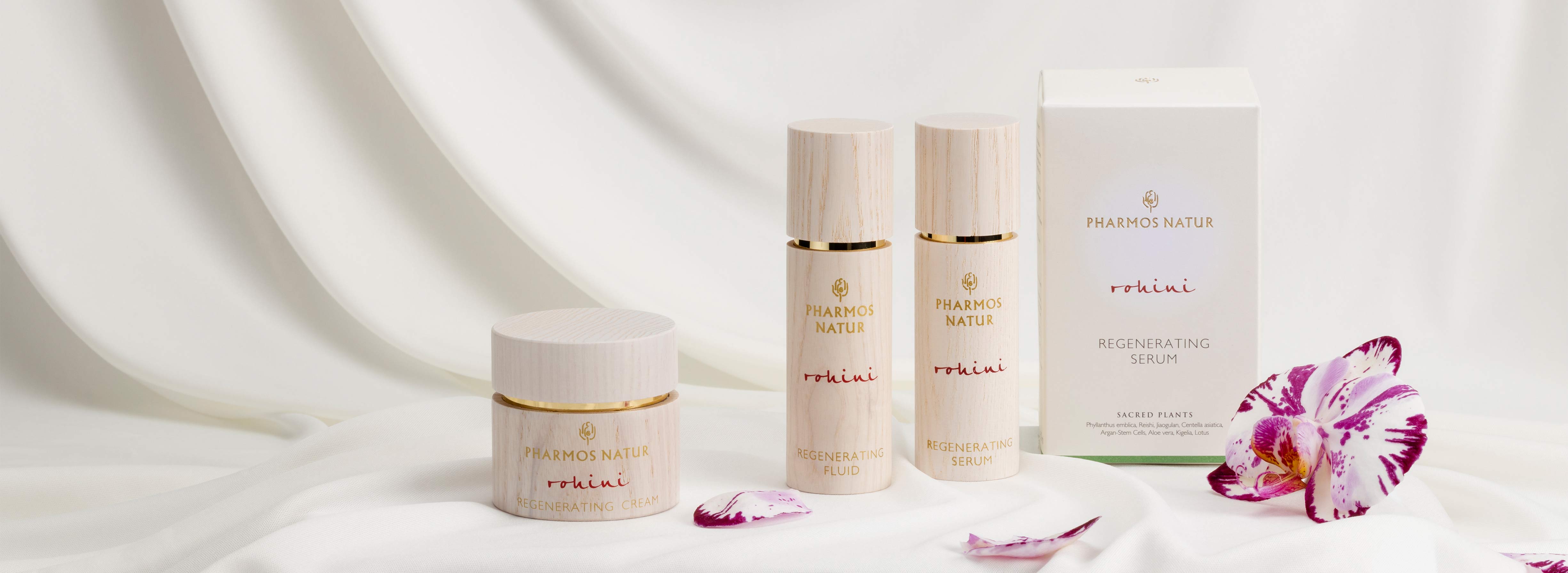 Produktlinie Rohini mit Serum, Fluid, Cream vor weißem Tuch