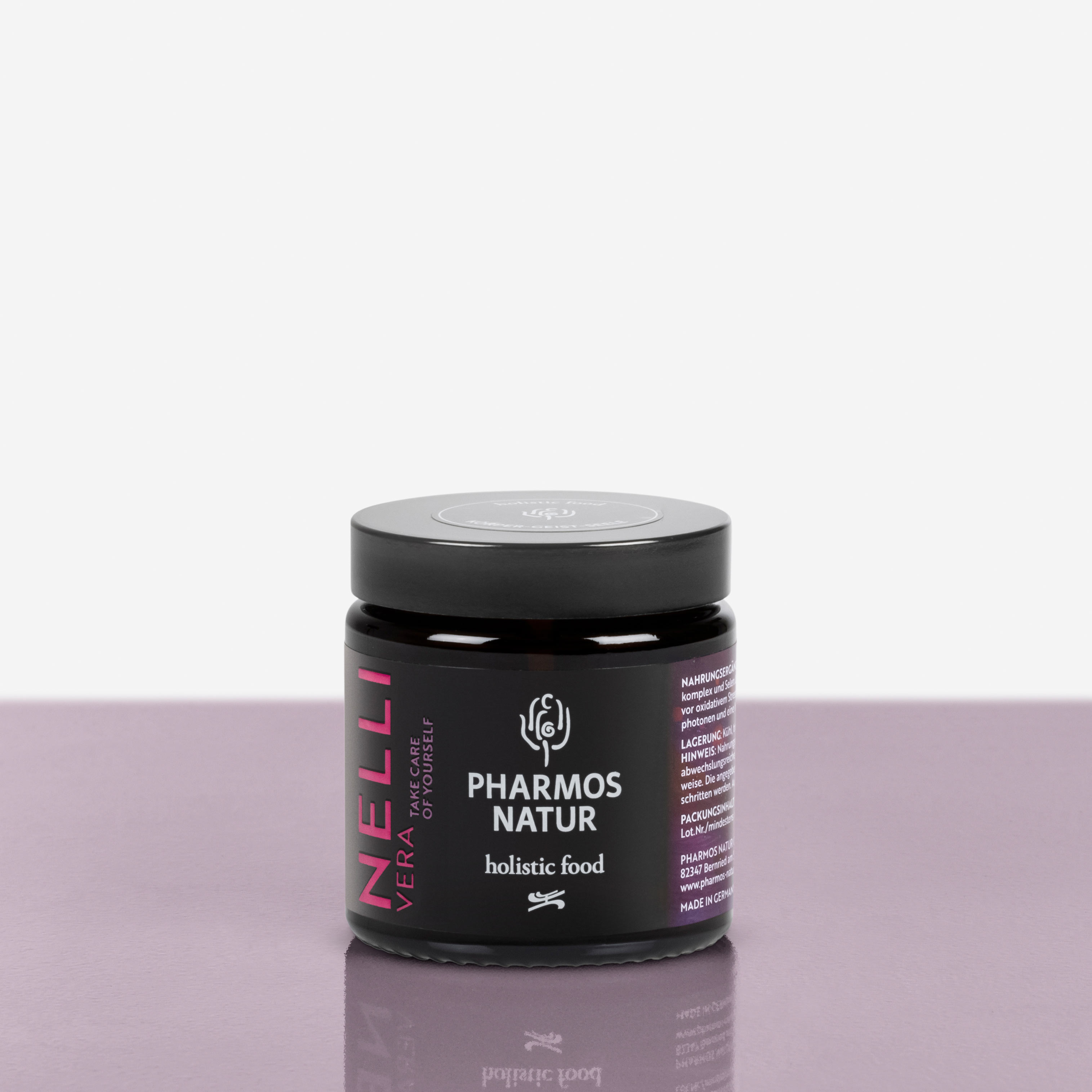 Nelli Vera dunkler Behälter Produktbild neben Pulver und Verpackung